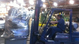 Rey moving the machine off the delivery truck.