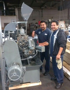 Rey and Sal unpacking the machine.